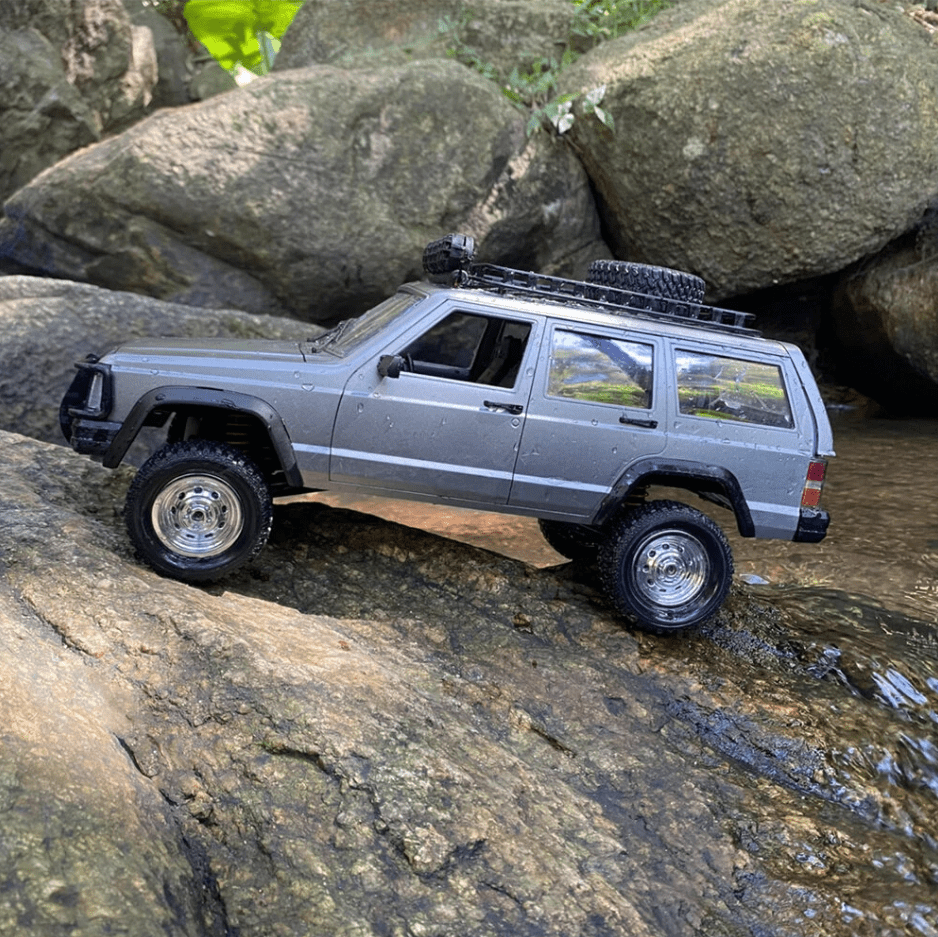 Auto a Control Remoto - 1/12 Jeep Cherokee XJ - MN78 Gris o Azul - Jugueteria del Sur