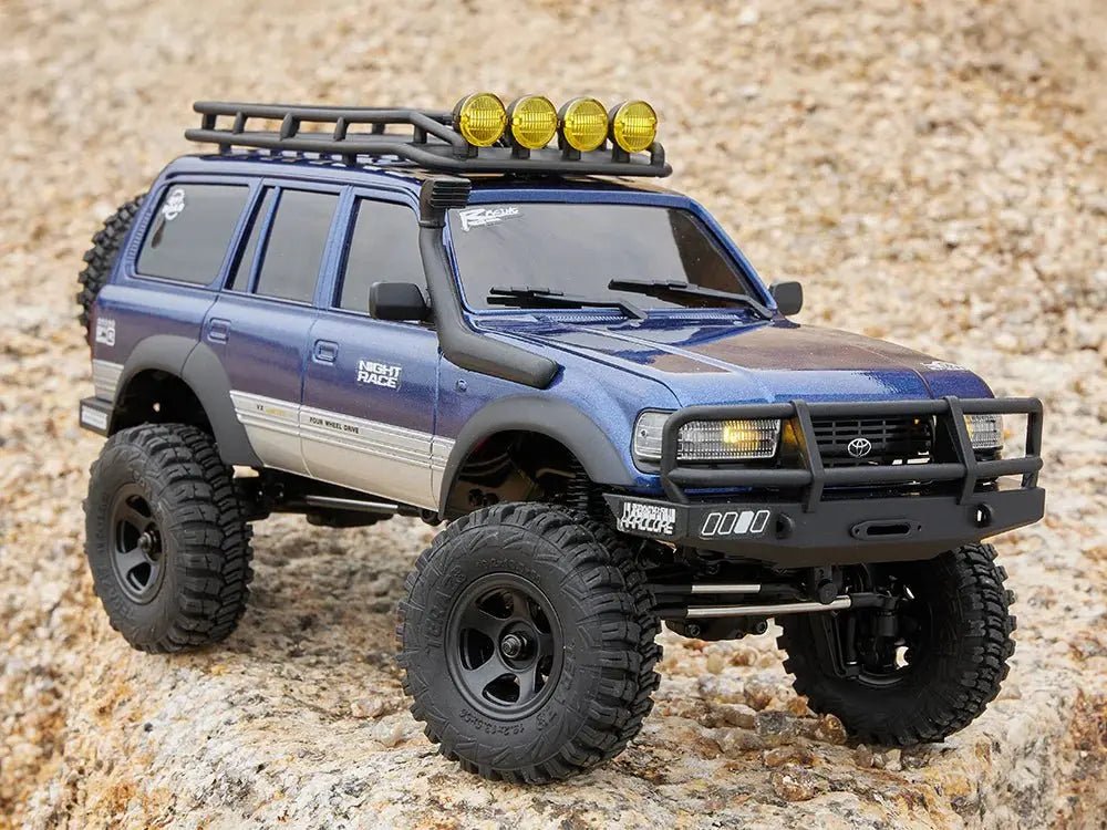 Auto a Control Remoto - 1/18 TOYOTA Land Cruiser 80 - FMS FCX18 LC80 V2 Gris o Amarillo o Azul - Jugueteria del Sur