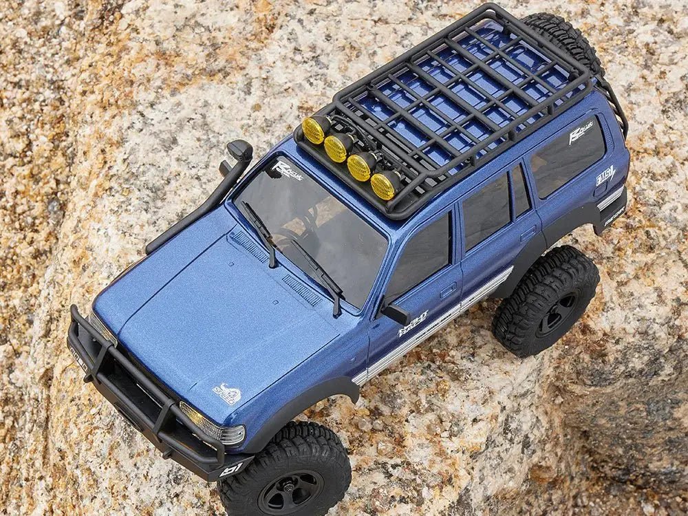 Auto a Control Remoto - 1/18 TOYOTA Land Cruiser 80 - FMS FCX18 LC80 V2 Gris o Amarillo o Azul - Jugueteria del Sur