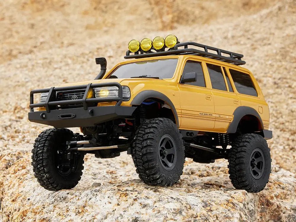 Auto a Control Remoto - 1/18 TOYOTA Land Cruiser 80 - FMS FCX18 LC80 V2 Gris o Amarillo o Azul - Jugueteria del Sur
